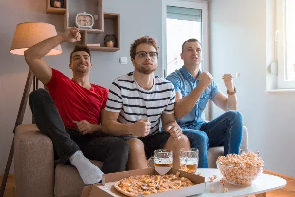 friends watching sport game